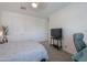 Bedroom featuring a gray comforter, side tables and neutral decor for a relaxing and inviting space at 277 W Glacier Bay Dr, San Tan Valley, AZ 85140