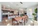 Open-concept dining area with an island kitchen and spacious living area, perfect for entertaining at 277 W Glacier Bay Dr, San Tan Valley, AZ 85140