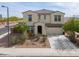 This two-story home has professional landscaping, a private driveway and a spacious 2-car garage at 277 W Glacier Bay Dr, San Tan Valley, AZ 85140