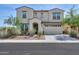 Charming two-story home with a neutral color palette, two-car garage, and low-maintenance desert landscaping at 277 W Glacier Bay Dr, San Tan Valley, AZ 85140