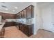 A fully equipped kitchen includes a large island, lots of cabinets and modern stainless steel appliances at 277 W Glacier Bay Dr, San Tan Valley, AZ 85140