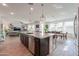 Kitchen boasts a large island, stainless steel appliances, and an open layout that flows into the living area at 277 W Glacier Bay Dr, San Tan Valley, AZ 85140