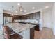 Kitchen with sleek countertops, stainless steel appliances, and seating for casual dining at the island at 277 W Glacier Bay Dr, San Tan Valley, AZ 85140