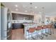 Chef's kitchen featuring a central island with bar seating, stainless steel appliances, and ample counter space at 277 W Glacier Bay Dr, San Tan Valley, AZ 85140