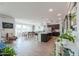 Spacious living area featuring a dining table and views of the well-equipped kitchen with modern appliances at 277 W Glacier Bay Dr, San Tan Valley, AZ 85140