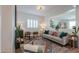 Bright living room with neutral colors, modern decor, and plantation shutters creates an inviting space at 277 W Glacier Bay Dr, San Tan Valley, AZ 85140