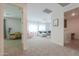 Spacious living room with plush carpet and multiple seating areas, perfect for Gathering gatherings at 277 W Glacier Bay Dr, San Tan Valley, AZ 85140