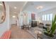Open-concept living room with tile flooring, neutral paint, modern decor and plenty of natural light at 277 W Glacier Bay Dr, San Tan Valley, AZ 85140