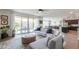 Cozy living space with sliding doors offering access to the backyard and inviting outdoor space at 277 W Glacier Bay Dr, San Tan Valley, AZ 85140