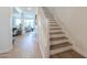 Bright staircase leading to the upper level, with views into the adjacent living area at 277 W Glacier Bay Dr, San Tan Valley, AZ 85140