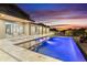 Inviting pool area with a spa, modern lounge seating, and sunset views at 29599 N 106Th Pl, Scottsdale, AZ 85262