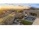 Modern home featuring a pool, spa, artificial turf, and desert landscaping at 29599 N 106Th Pl, Scottsdale, AZ 85262