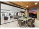 A seamless transition with open glass walls brings the outdoors in to this luxury living space at 29599 N 106Th Pl, Scottsdale, AZ 85262