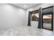 Bedroom with a view to the backyard, featuring tile floors and modern gray curtains at 29599 N 106Th Pl, Scottsdale, AZ 85262