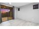 Minimalist bedroom with a sliding glass door providing natural light and outdoor access at 29599 N 106Th Pl, Scottsdale, AZ 85262
