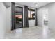 Spacious bedroom with gray window coverings, large window, and access to the backyard at 29599 N 106Th Pl, Scottsdale, AZ 85262