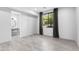 Bright bedroom with tiled floors, large window, and view into the en-suite bathroom at 29599 N 106Th Pl, Scottsdale, AZ 85262