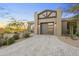 Beautiful front facade with desert landscaping, stone driveway, and stylish architectural design at 29599 N 106Th Pl, Scottsdale, AZ 85262