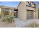 Charming front entrance with a stone walkway, desert plants, and modern architectural details at 29599 N 106Th Pl, Scottsdale, AZ 85262