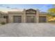 A spacious three car garage with brick pavers adds curb appeal to this home at 29599 N 106Th Pl, Scottsdale, AZ 85262