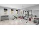 Home gym equipped with weightlifting equipment and mirrors for a complete workout space at 29599 N 106Th Pl, Scottsdale, AZ 85262