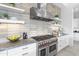 The kitchen features stainless steel appliances, a brick backsplash, and ample counter space at 29599 N 106Th Pl, Scottsdale, AZ 85262
