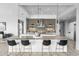 Modern kitchen featuring a large island with seating, pendant lighting, and professional-grade appliances at 29599 N 106Th Pl, Scottsdale, AZ 85262