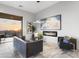 Sophisticated living room boasts a modern fireplace, stylish decor, and expansive views beyond the sliding doors at 29599 N 106Th Pl, Scottsdale, AZ 85262