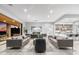 Spacious living area with designer furnishings, contemporary fireplace, and floor-to-ceiling windows offering views at 29599 N 106Th Pl, Scottsdale, AZ 85262