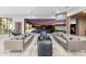 Spacious living room with stylish furnishings, direct access to a patio and beautiful pool area at 29599 N 106Th Pl, Scottsdale, AZ 85262