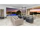 Bright living area with access to the outdoor pool. Comfortable seating and large sliding windows at 29599 N 106Th Pl, Scottsdale, AZ 85262