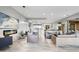 Open-concept living space featuring a linear fireplace, comfortable sofas and seamless flow to outdoor areas at 29599 N 106Th Pl, Scottsdale, AZ 85262