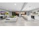 Open floor plan combines a living room, kitchen, and dining area with modern decor at 29599 N 106Th Pl, Scottsdale, AZ 85262