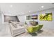 Basement living area features modern decor and a ping pong table near the stairwell at 29599 N 106Th Pl, Scottsdale, AZ 85262