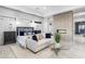 A spacious bedroom with natural light, seating area, and modern decor and fireplace at 29599 N 106Th Pl, Scottsdale, AZ 85262