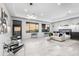 A spacious bedroom with natural light, seating area, and modern decor at 29599 N 106Th Pl, Scottsdale, AZ 85262