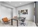 Modern office space with large window, unique art, and stylish furniture at 29599 N 106Th Pl, Scottsdale, AZ 85262
