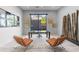 Modern office space with large window, unique art, and stylish furniture at 29599 N 106Th Pl, Scottsdale, AZ 85262