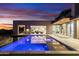 Stunning pool with clear blue water with views to home's interior and second-story balcony at 29599 N 106Th Pl, Scottsdale, AZ 85262