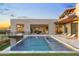 Luxurious pool with a spa, lounge chairs, and seamless indoor-outdoor living space at 29599 N 106Th Pl, Scottsdale, AZ 85262