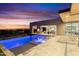 Beautifully landscaped pool with integrated spa, deck loungers, and sunset views at 29599 N 106Th Pl, Scottsdale, AZ 85262