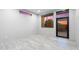 Bright room features neutral walls and flooring, large window showcasing the exterior view, and ample natural light at 29599 N 106Th Pl, Scottsdale, AZ 85262