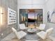 Stylish sitting area with modern furnishings, artistic decor, and sliding glass doors to the exterior at 29599 N 106Th Pl, Scottsdale, AZ 85262
