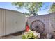 Backyard shed with garden decorations, rock wall, and storage space at 304 W 6Th St, Mesa, AZ 85201