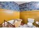 Charming bathroom features a classic clawfoot tub, colorful wallpaper, and stylish fixtures at 304 W 6Th St, Mesa, AZ 85201