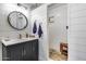 Modern bathroom features shiplap walls, a dark vanity, and a walk-in shower with stylish fixtures at 304 W 6Th St, Mesa, AZ 85201