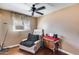Comfortable bedroom featuring a relaxing chair, hardwood floors, and natural light at 304 W 6Th St, Mesa, AZ 85201