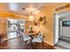 Charming dining area with a round table, decorative lighting, and an open doorway to the living room at 304 W 6Th St, Mesa, AZ 85201
