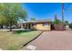 Charming single-story home with a well-maintained front yard and convenient carport at 304 W 6Th St, Mesa, AZ 85201