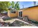Exterior view of the home featuring a patio, backyard, stucco walls and a sliding glass door at 304 W 6Th St, Mesa, AZ 85201